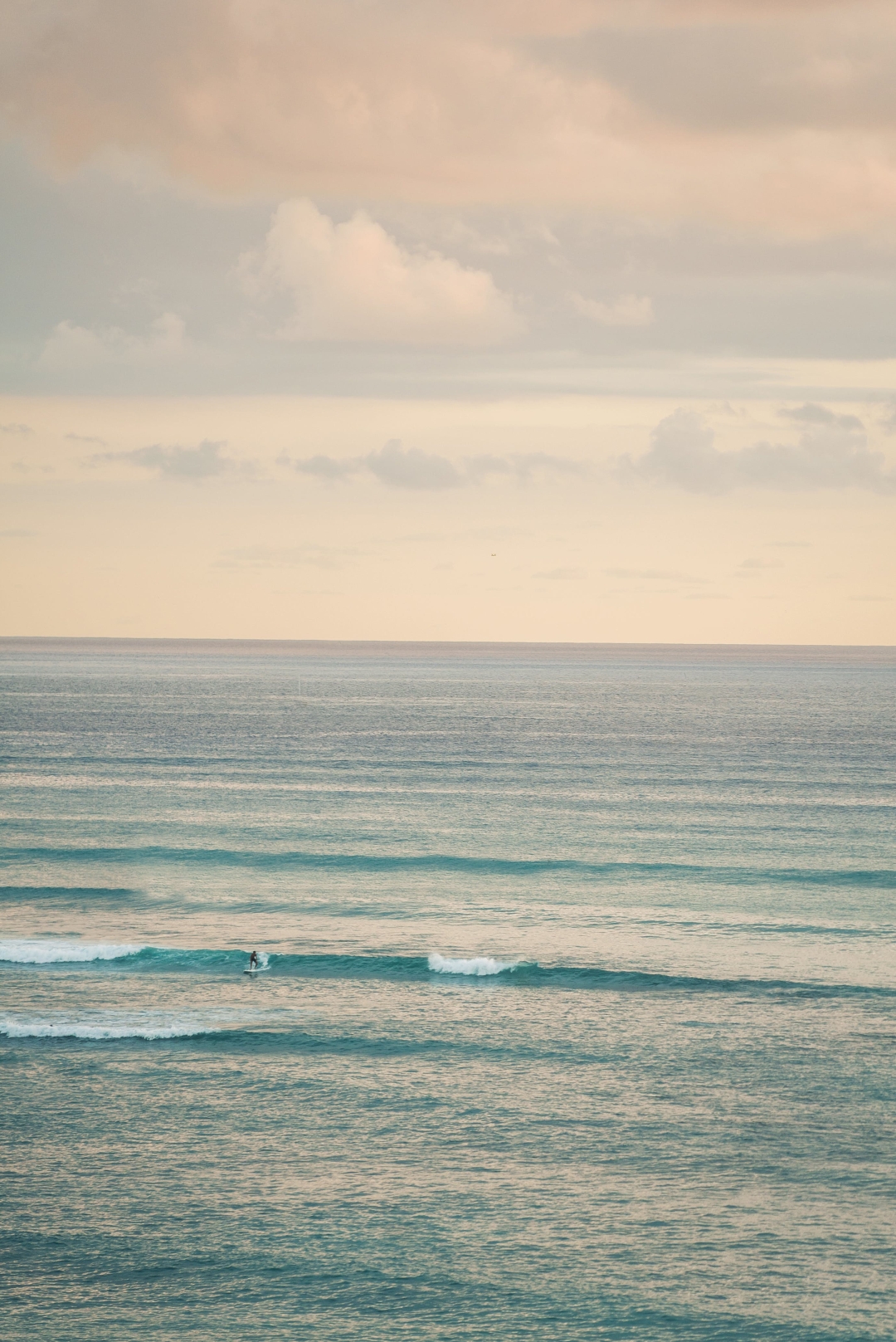 Rolling waves at sunset